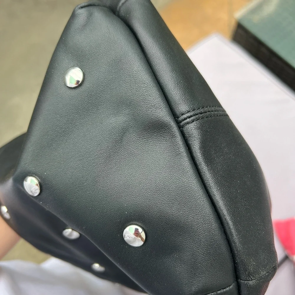 Maje “le bow bag” in black leather with silver studs